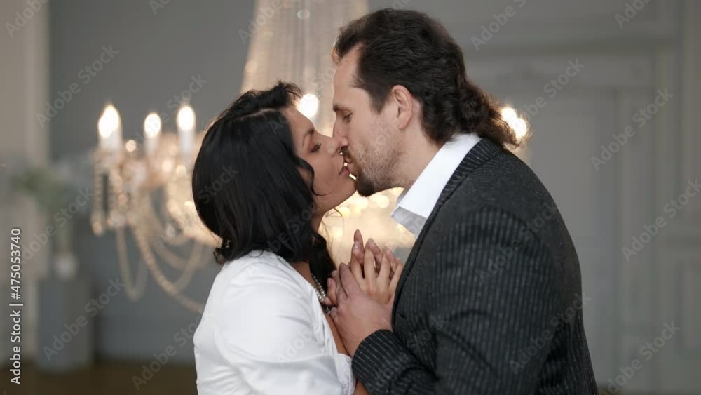 kiss of lovers in wedding day, beautiful bride and handsome groom are hugging and kissing kiss of lovers in wedding day, beautiful bride and handsome groom are hugging and kissing