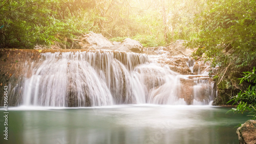 Waterfall in the forest.Green-Waterfall-River-rocks-covered-with-green-moss-Forest-Waterfall. deep forest at center of the forest with a waterfall. quiet and pleasant environment for tourism.