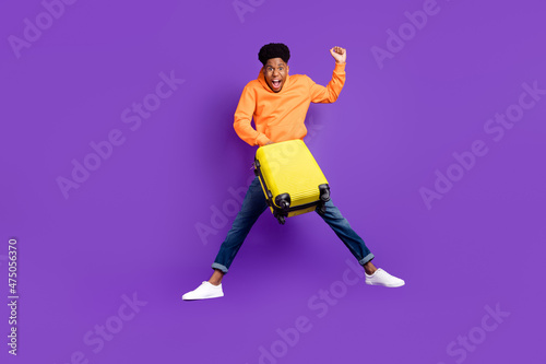 Slika na platnu Full length body size view of attractive trendy cheery lucky guy jumping holding