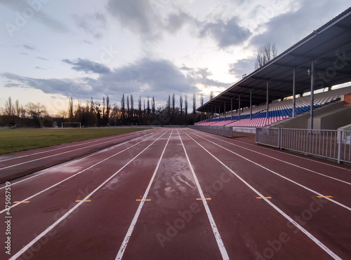 Running tracks in the stadium in evening in winter