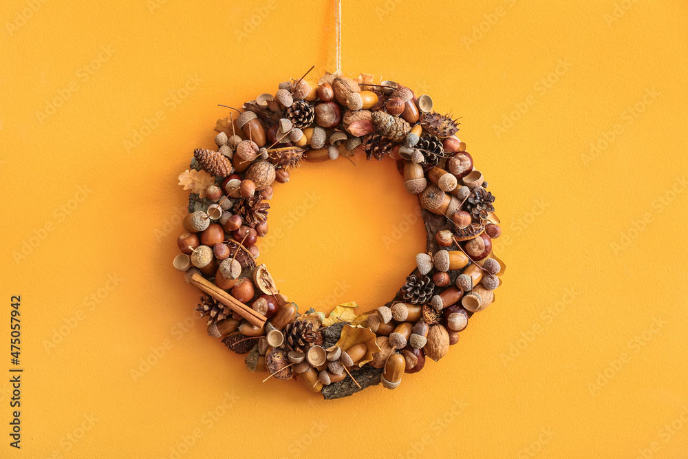 Beautiful acorn wreath on orange wall Beautiful acorn wreath on orange wall