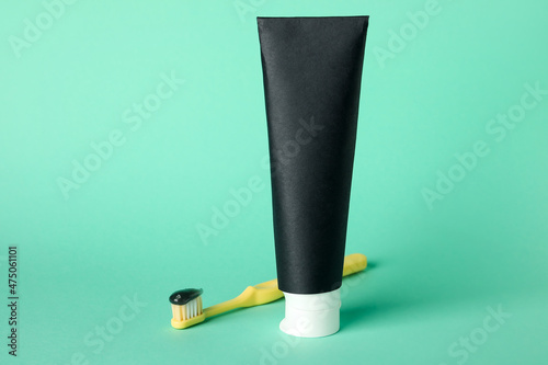 Tube of black tooth paste a...
