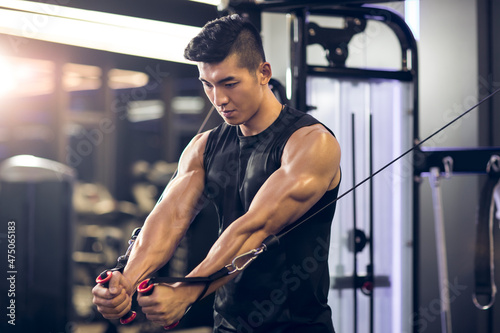 Young man exercising at gym