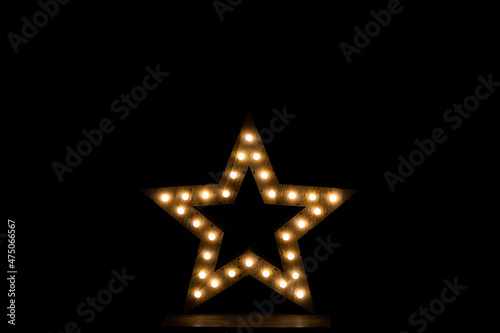 Wooden star with lights for christmas decoration