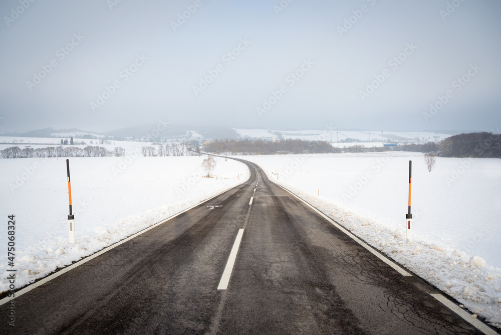  Country road in snowy winter day