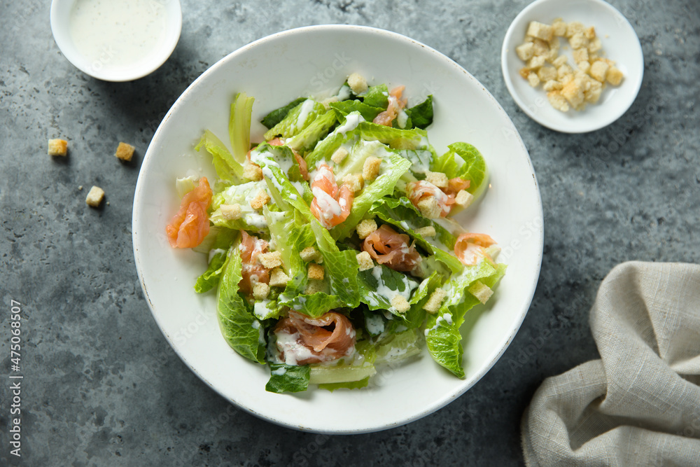 Traditional homemade Caesar salad with smoked salmon