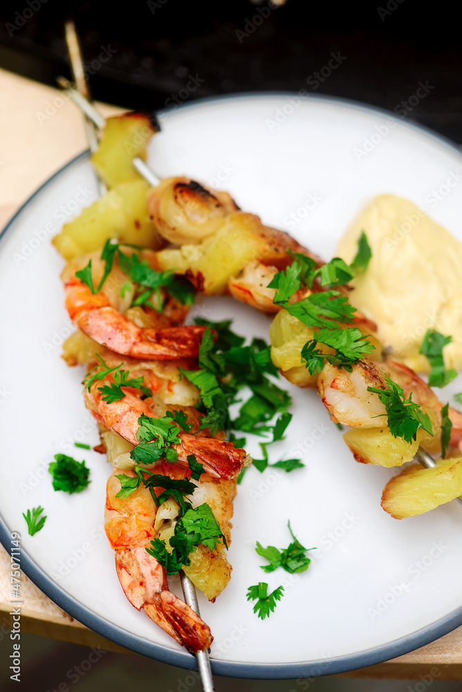 Shrimp with pineapples on the grilled in the yard Shrimp with pineapples on the grilled in the yard