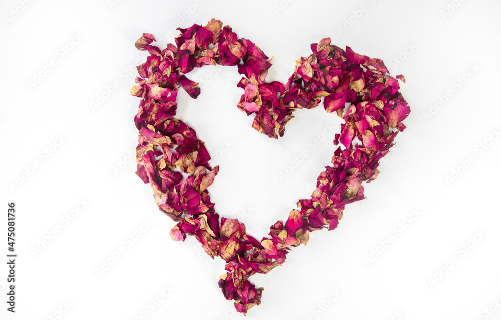 beautiful heart of dried red rose petals isolated on white background, copy space, Valentines Day romantic concept
