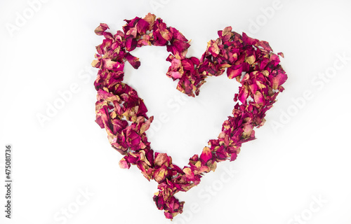 beautiful heart of dried red rose petals isolated on white background, copy space, Valentines Day romantic concept