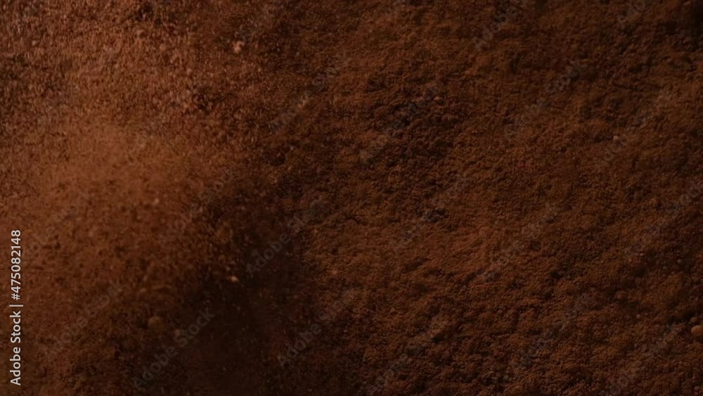 closeup view of an center of heavy explosion on floor with cocao , for cafe cacao drinking advertising