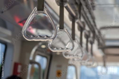 A transparent plastic handrail in a train bokey