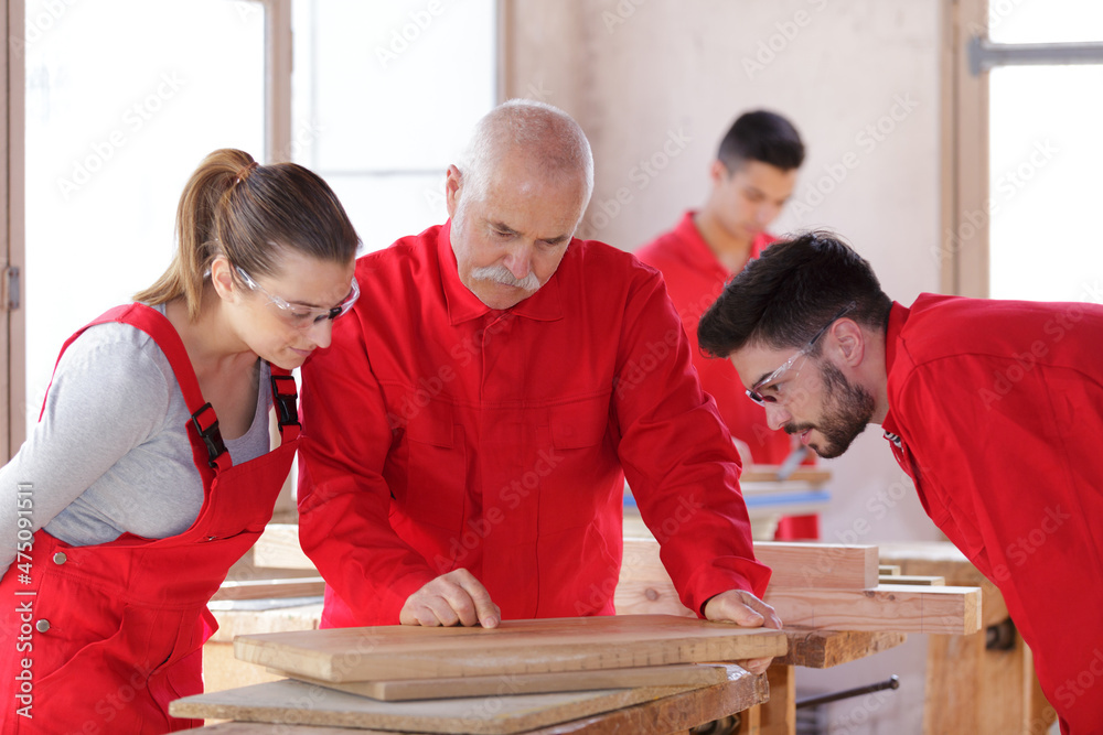 carpenter team in wood workshop
