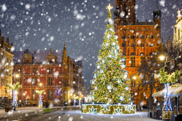 Beautiful Christmas tree in the old town of Gdansk at snowy night. Poland
