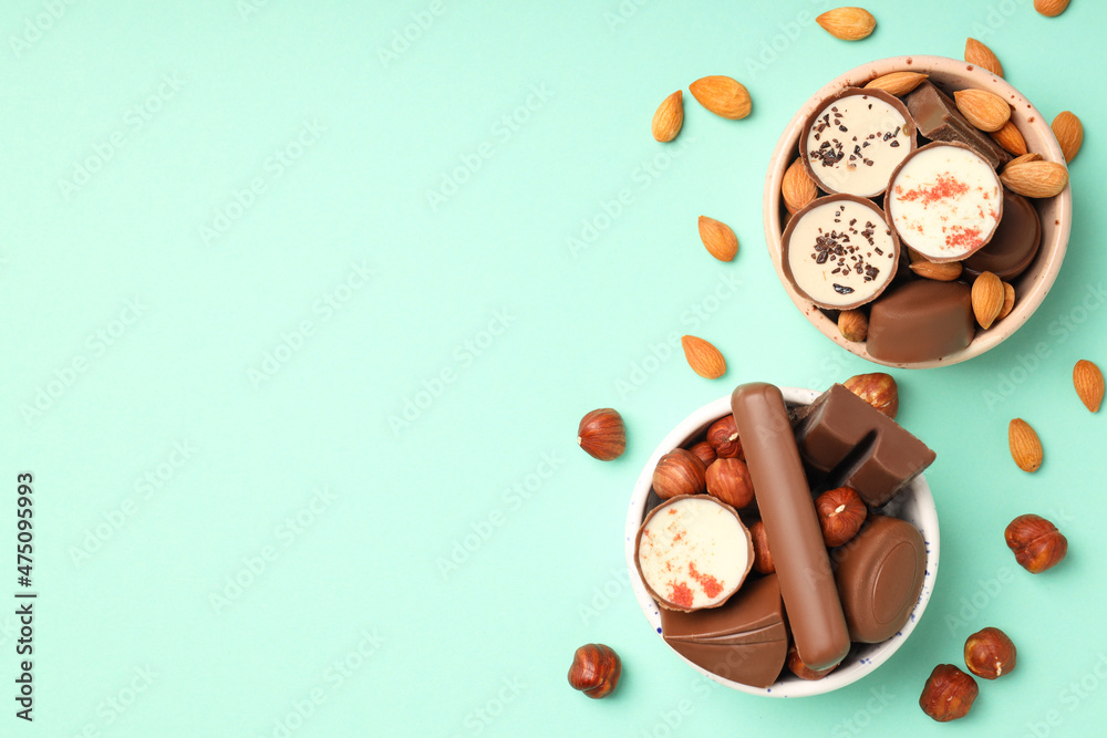 Fototapeta premium Concept of sweets with chocolate candies on mint background