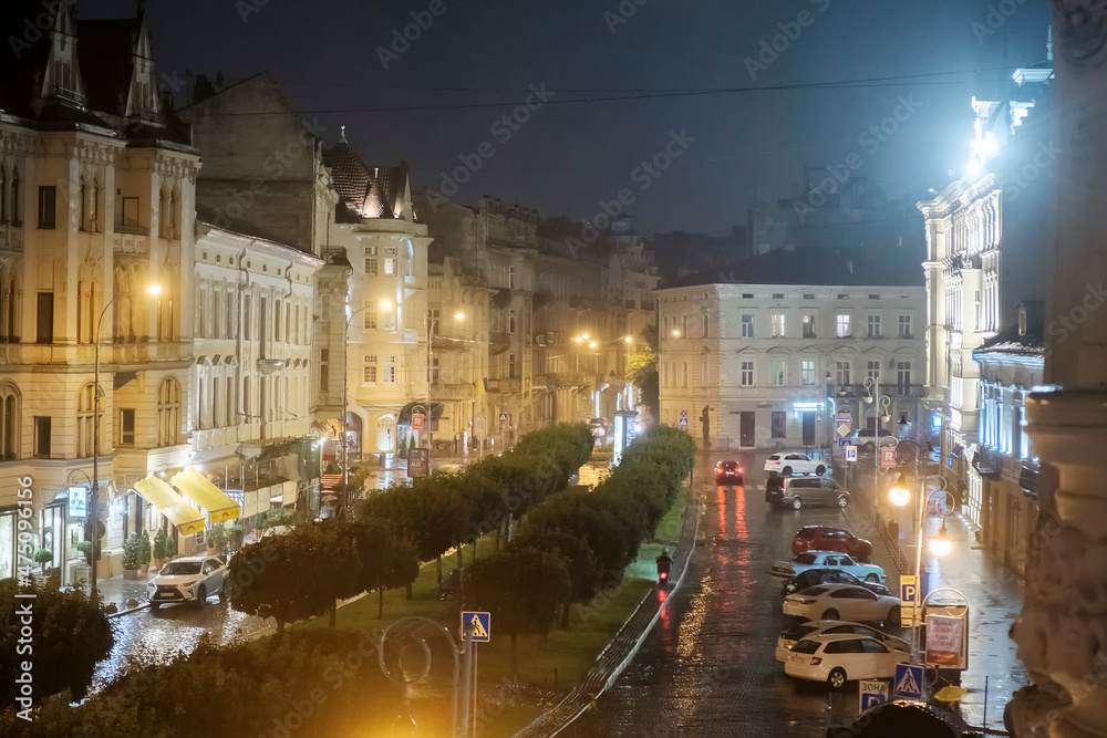 Night rainy view to the Shevchenko Prospect in Lviv, Ukraine. October 2021