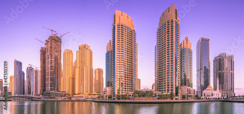 Day view of Dubai Marina bay with clear sky, UAE