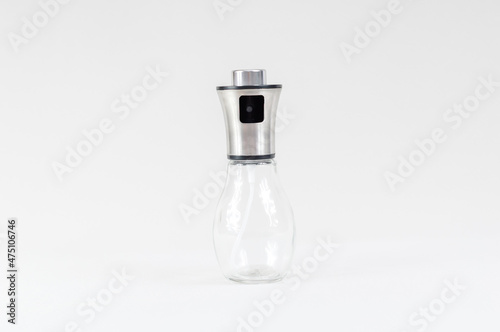 Spray bottle isolated on grey