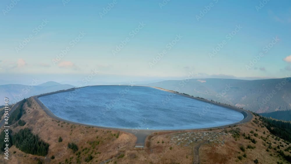 Pumped water storage hydroelectric plant reservoir aerial view Pumped water storage hydroelectric plant reservoir aerial view