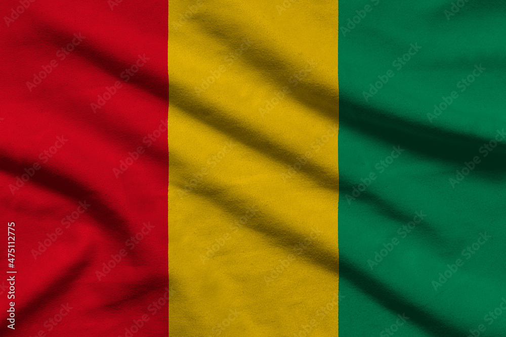Guinea flag on wavy fabric.