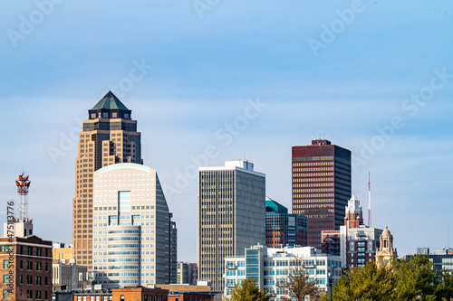 Downtown Des Moines, Iowa skyline through green railroad bridge. photo