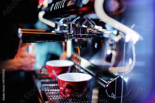 Stampa su Tela espresso shot from coffee machine in coffee shop,Coffee maker in coffee shop