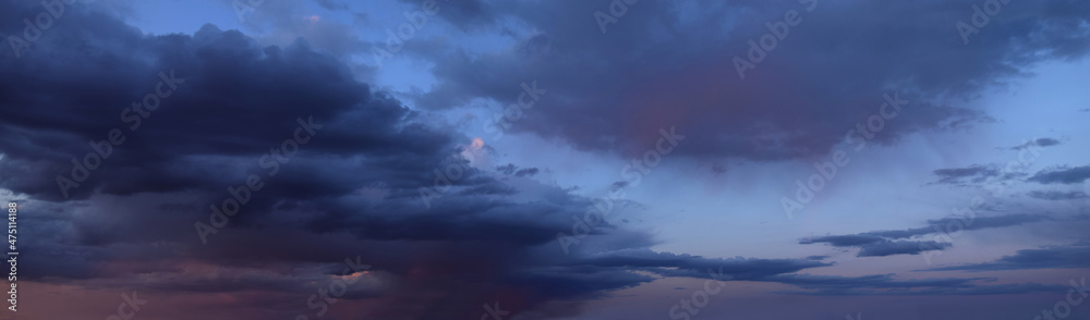 Beautiful sunset with cumulus clouds
Panoramic photography, the image is horizontally elongated, atmospheric 
phenomenon