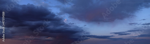 Beautiful sunset with cumulus clouds Panoramic photography, the image is horizontally elongated, atmospheric phenomenon