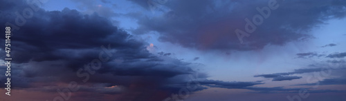 Beautiful sunset with cumulus clouds
Panoramic photography, the image is horizontally elongated, atmospheric 
phenomenon