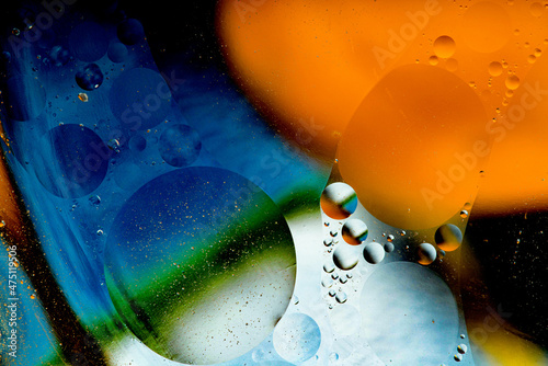 Abstract colorful background of oil circles. Oil in circles on the water surface  water foam and oil colored bubbles.