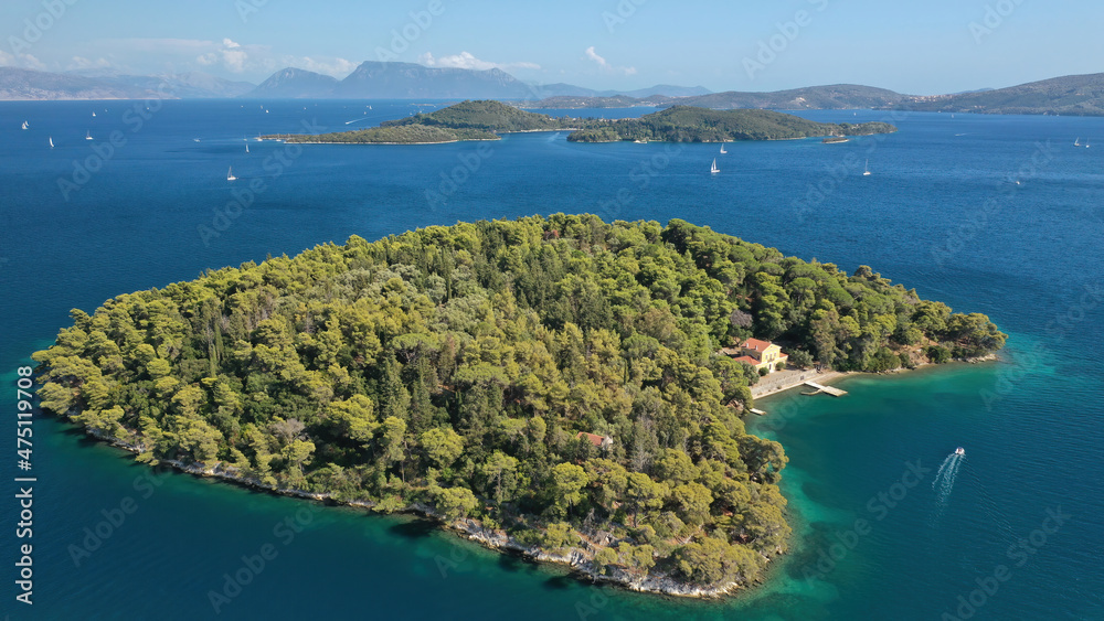 Aerial drone photo of iconic island of Madouri in bay of Nydri and Mansion of 19th-century poet Aristotelis Valaoritis, Lefkada, Ionian, Greece