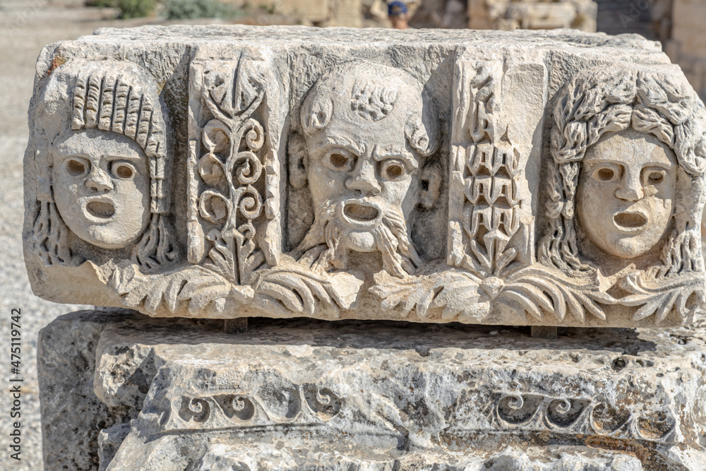 Ancient greek stone carvings in the yellow limestone rock. Facade of the building decoration in antique style Ancient greek stone carvings in the yellow limestone rock. Facade of the building decoration in antique style