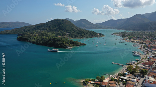 Fototapeta Naklejka Na Ścianę i Meble -  Aerial drone photo of fjord shaped port of Nydri a calm sea safe anchorage for sail boats and yachts famous for trips to Meganisi, Skorpios and other Ionian islands, Lefkada island, Greece
