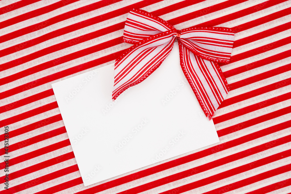 Obraz premium Blank greeting card with red and white candy cane bows