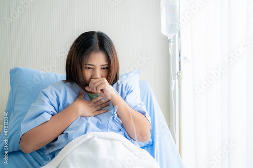 asian women is currently being treated in the hospital with a strong cough