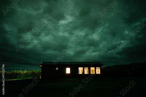 Obraz na plátne scary house with green sky at night