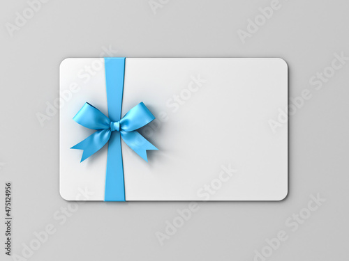 Blank white gift card with blue ribbon bow isolated on gray background with shadow minimal concept 3D rendering