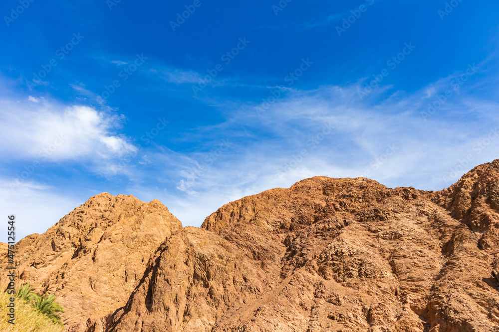 mountain and the blue cloudy skies