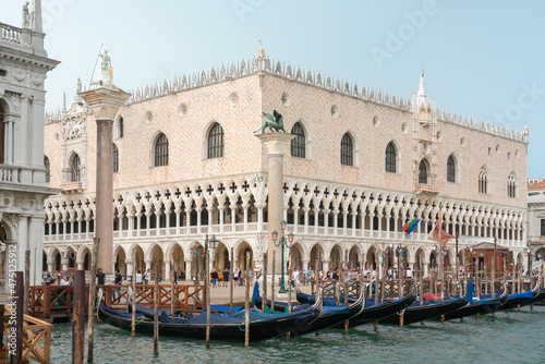 Doge's Palace in Venice from Grand Canal with gondolas and wooden piers