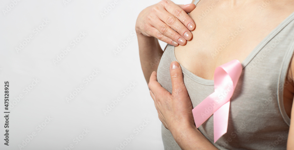 Middle aged caucasian woman doing breast self examination Middle aged caucasian woman doing breast self examination