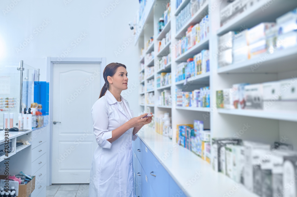 Female pharmacist working in a drugstore