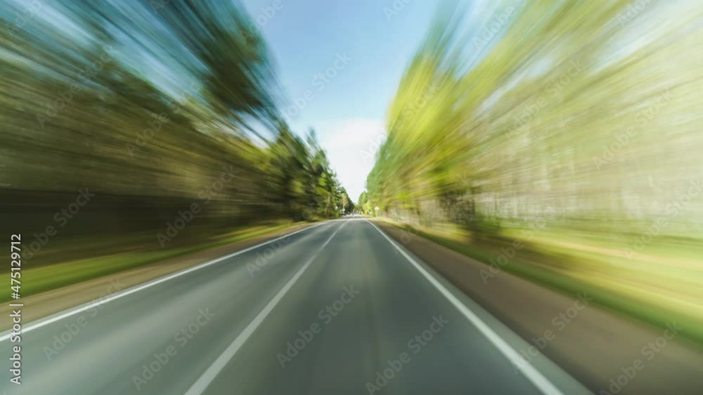 High Speed On The Open Road Fast Car Hyperlapse Car Driving on Country Road Through Small Suburbia Road Trip Travel Concept. Freedom on the Road Sort of Dashcam POV High Speed On The Open Road Fast Car Hyperlapse Car Driving on Country Road Through Small Suburbia Road Trip Travel Concept. Freedom on the Road Sort of Dashcam POV