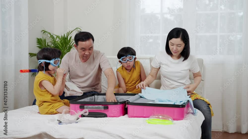 Asian family preparing clothes for luggage for tourism, concept of relaxation, travel, adventure
