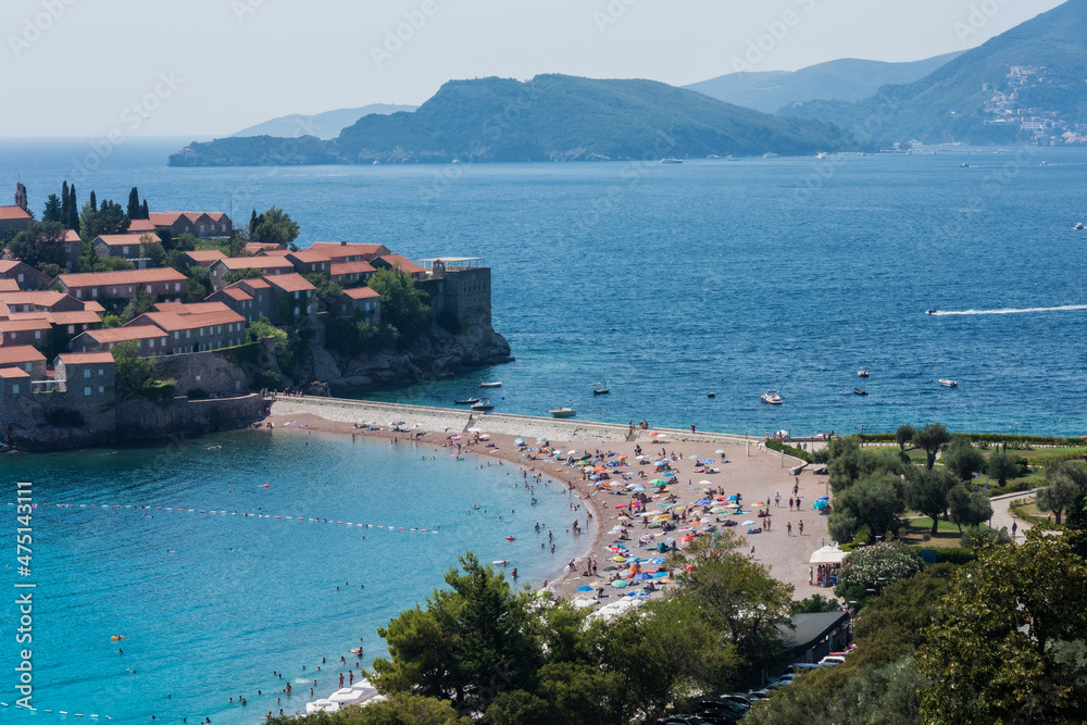 beautiful view of the beach and island Sveti-Stefan near Budva in Montenegro, Europe, Adriatic Sea and mountains