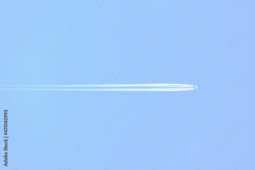 Traces and white streaks from the jet engines in the plane, white stripes in the sky. Traces and white streaks from the jet engines in the plane, white stripes in the sky.
