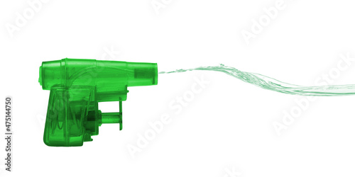 Green toy water pistol squirting a stream of colored water