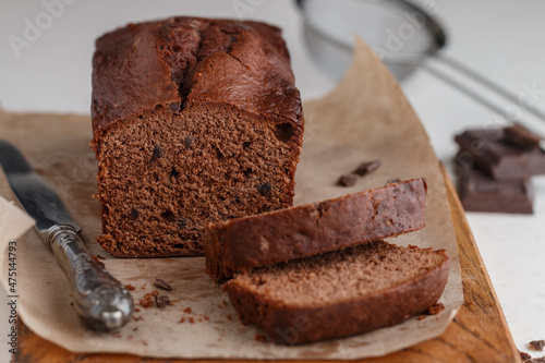 Homemade freshly baked chocolate pound cake loaf. Delicious homemade dessert. Slices on a cutting board. Selective focus