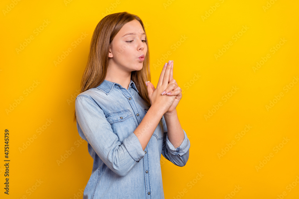 Photo of cute little blond girl hands gun wear jeans outfit isolated on vivid yellow color background Photo of cute little blond girl hands gun wear jeans outfit isolated on vivid yellow color background