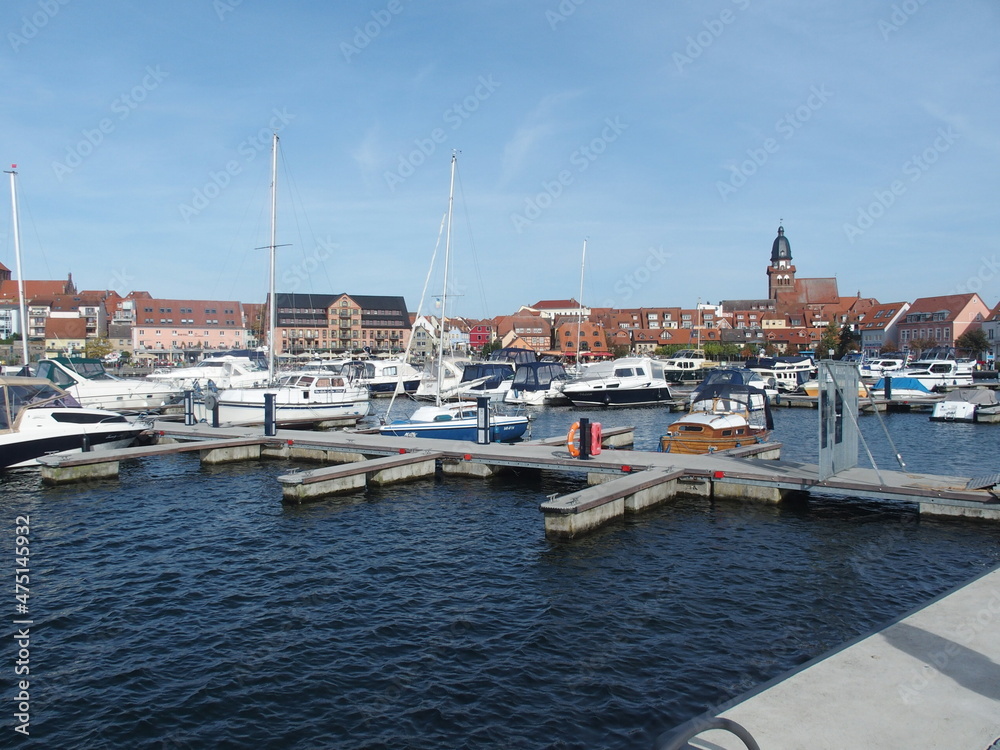 View over the Mueritz harbor to the old town of Waren, Mecklenburg-Western Pomerania, Germany, right St Marien Church