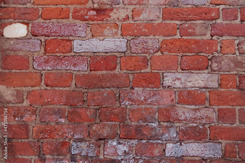 Old shabby red brick wall  worn background