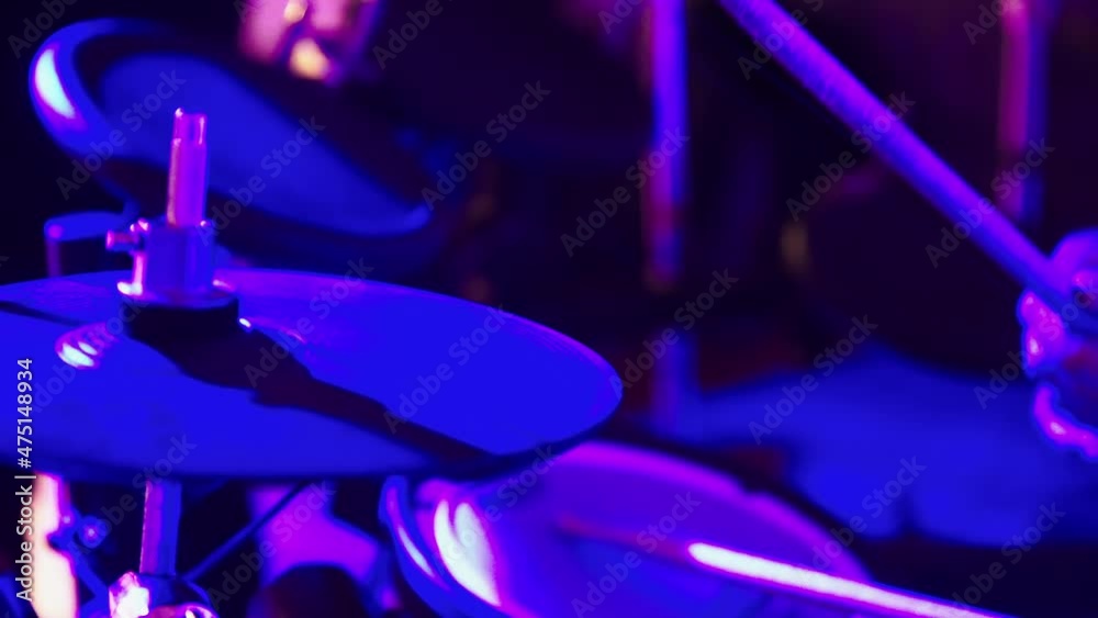 Close-up of a drummer hitting hi-hat cymbals. Blue lights. High quality 4k footage Close-up of a drummer hitting hi-hat cymbals. Blue lights. High quality 4k footage